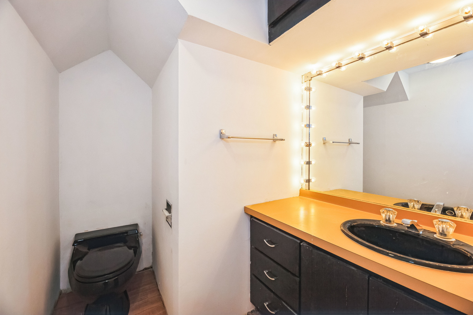 710 North 7th Street Rochelle, IL 61068 - Photo 10 of 32 a bathroom with a sink and a toilet