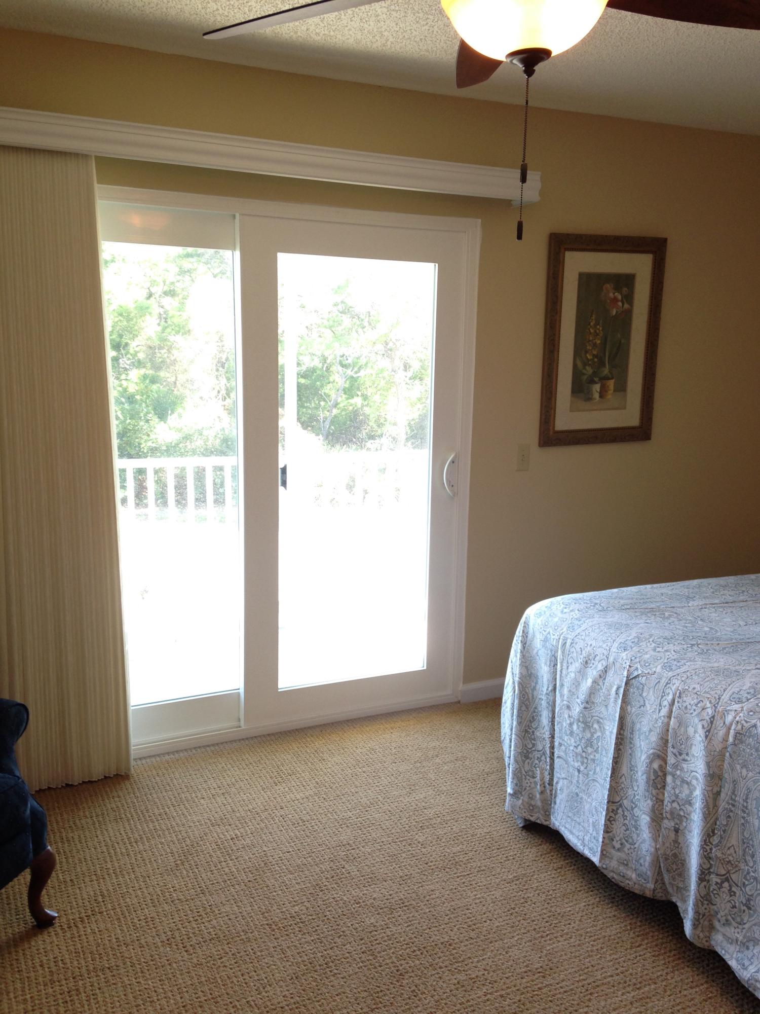 241 Ellis Road, Unit 6 Miramar Beach, FL 32550 - Photo 18 of 30 a bed sitting in a room next to a window