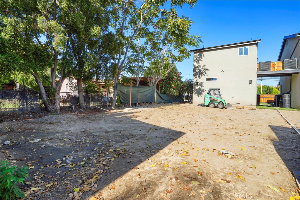 11531 Dronfield Avenue Pacoima, CA 91331 - Photo 9 of 12 a view of a backyard with large trees