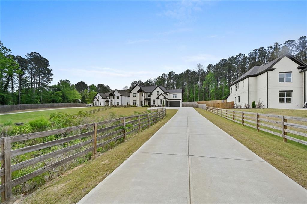 2694 Thompson Mill Road Buford, GA 30519 - Photo 3 of 70 a view of a house with a yard