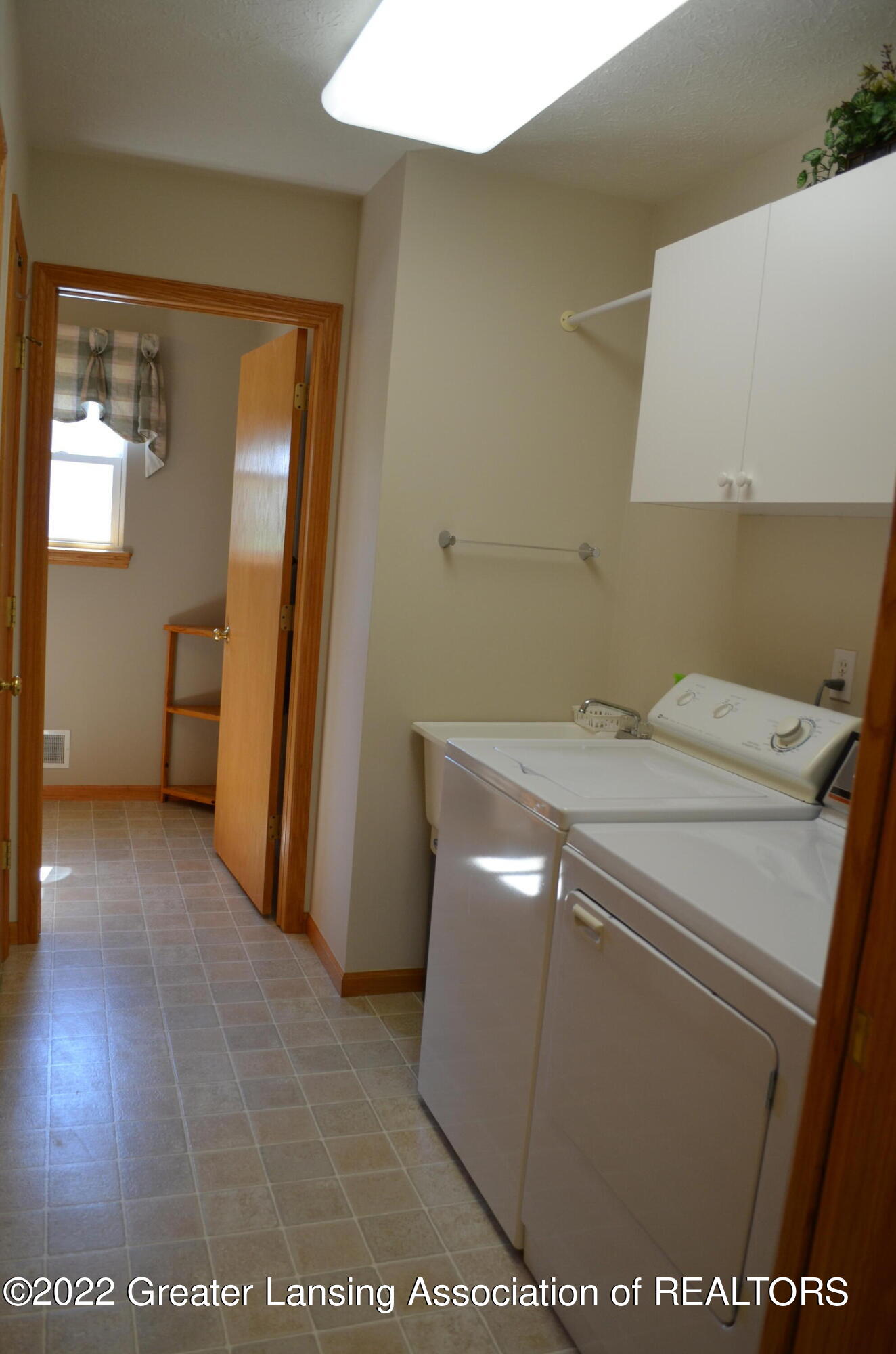 10833 Mack In Aw Trail Fowlerville, MI 48836 - Photo 20 of 59 1st floor laundry with half bath