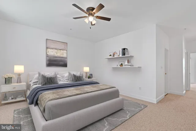 a bathroom with a granite countertop sink a mirror and shower