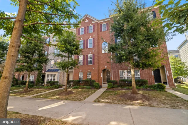 a view of a brick building next to a road