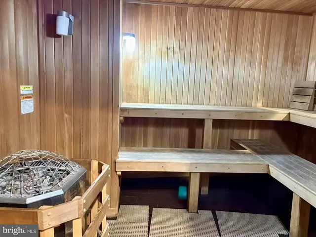 a view of house with swimming pool and furniture