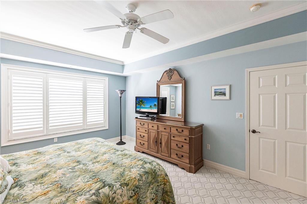 451 Bayfront Place, Unit 5309 Naples, FL 34102 - Photo 18 of 33 Bedroom with ornamental molding and a ceiling fan