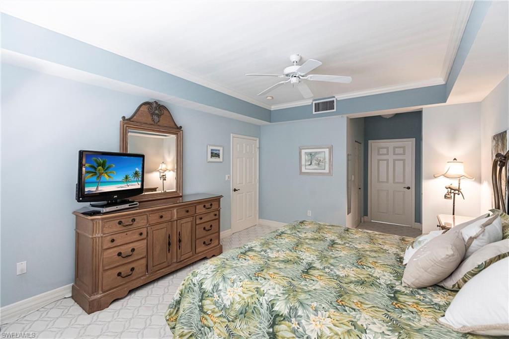 451 Bayfront Place, Unit 5309 Naples, FL 34102 - Photo 19 of 33 Bedroom featuring a ceiling fan and crown molding