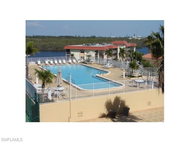 451 Bayfront Place, Unit 5309 Naples, FL 34102 - Photo 32 of 33 Community pool featuring a patio area