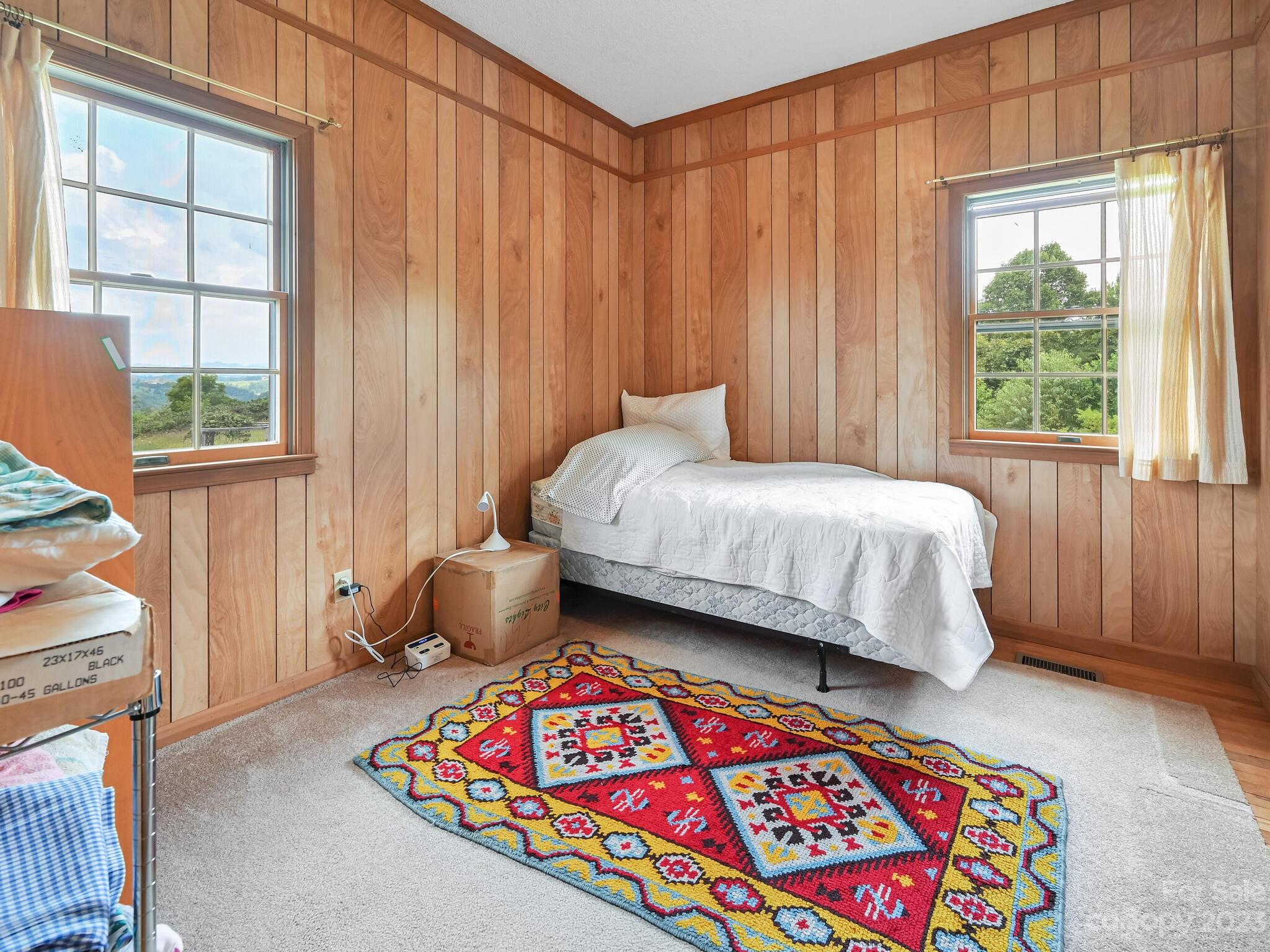 386 Heather Downs Drive Alexander, NC 28701 - Photo 23 of 29 a bedroom with a bed and a window