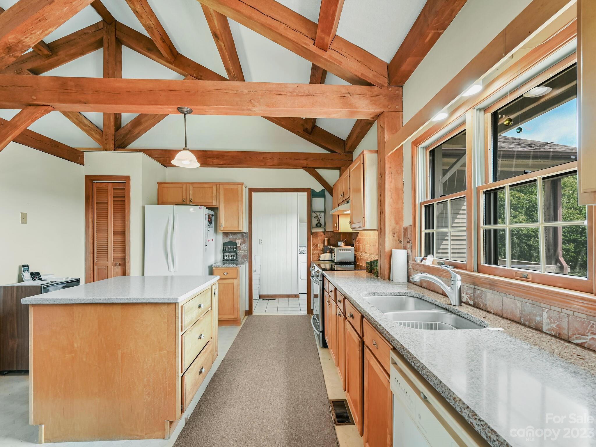 386 Heather Downs Drive Alexander, NC 28701 - Photo 8 of 29 a large white kitchen with a large window