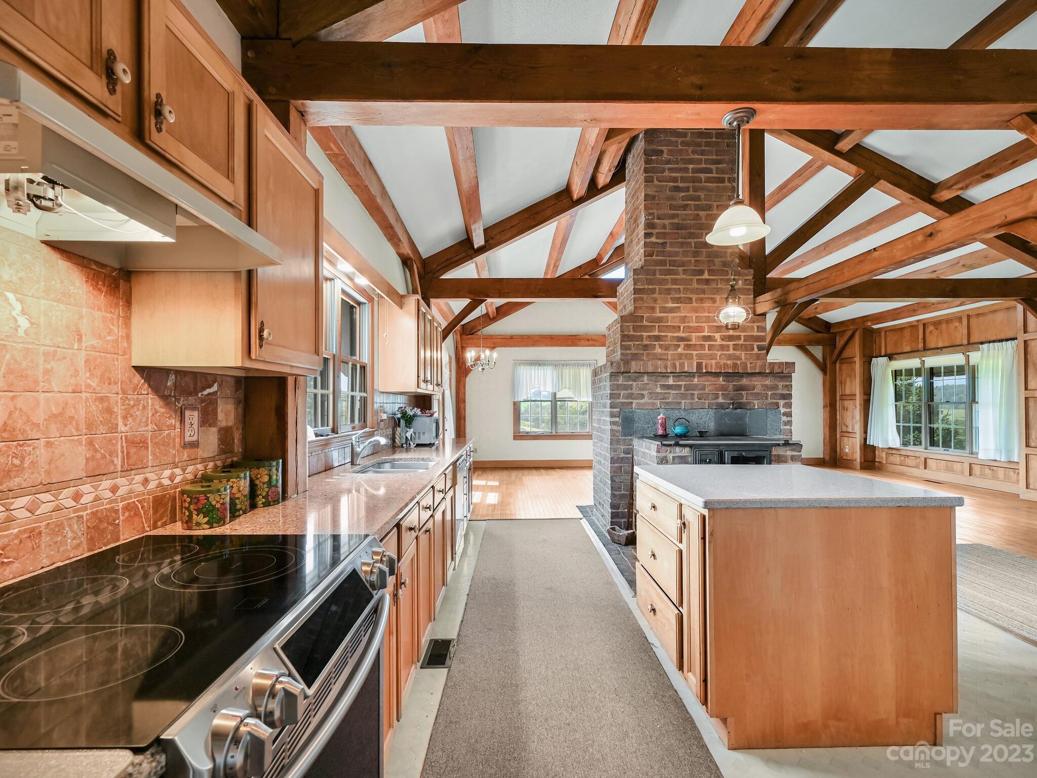 386 Heather Downs Drive Alexander, NC 28701 - Photo 10 of 29 a kitchen with stainless steel appliances granite countertop a stove and a sink