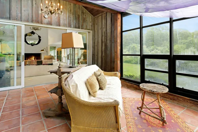 a bedroom with furniture and a window