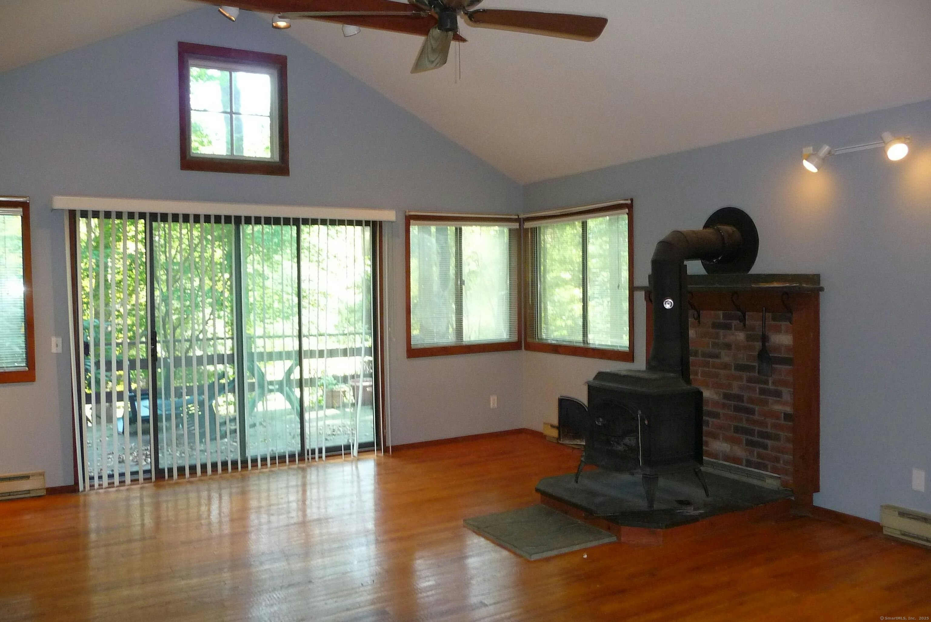 32 Beeholm Road Redding, CT 06896 - Photo 37 of 40 a living room with furniture and a floor to ceiling window