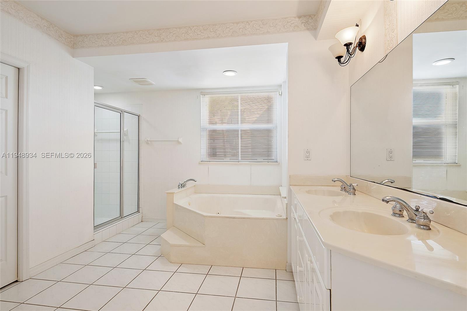 1660 Florida A1A, Unit 222 Jupiter, FL 33477 - Photo 13 of 34 a bathroom with a sink a toilet and shower