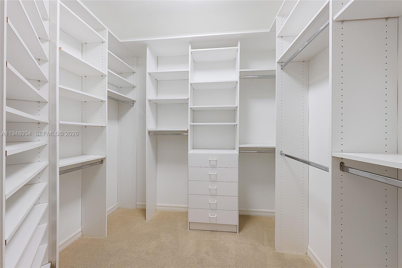 1660 Florida A1A, Unit 222 Jupiter, FL 33477 - Photo 14 of 34 a view of walk in closet with empty racks