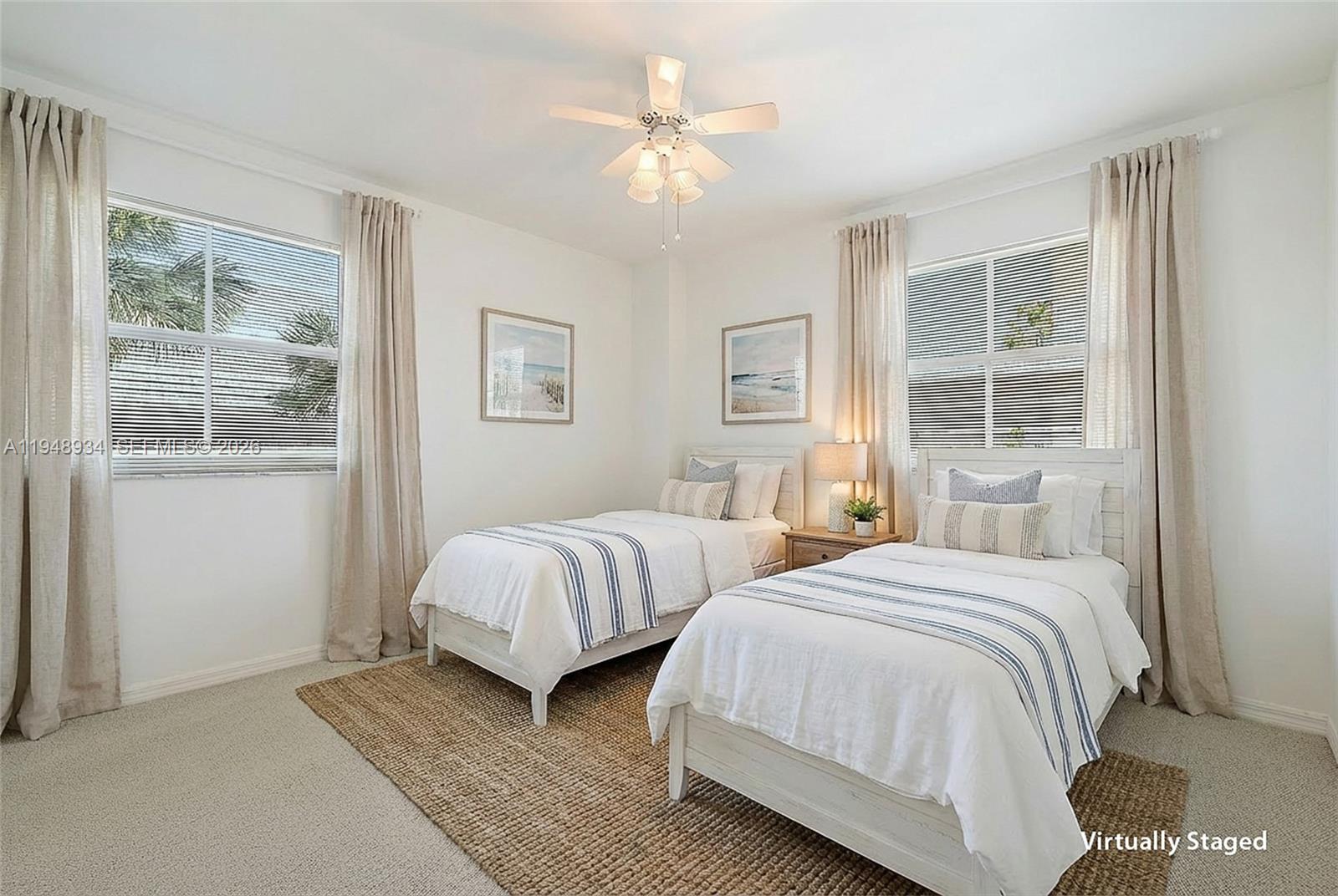 1660 Florida A1A, Unit 222 Jupiter, FL 33477 - Photo 16 of 34 a bedroom with two beds and a large window