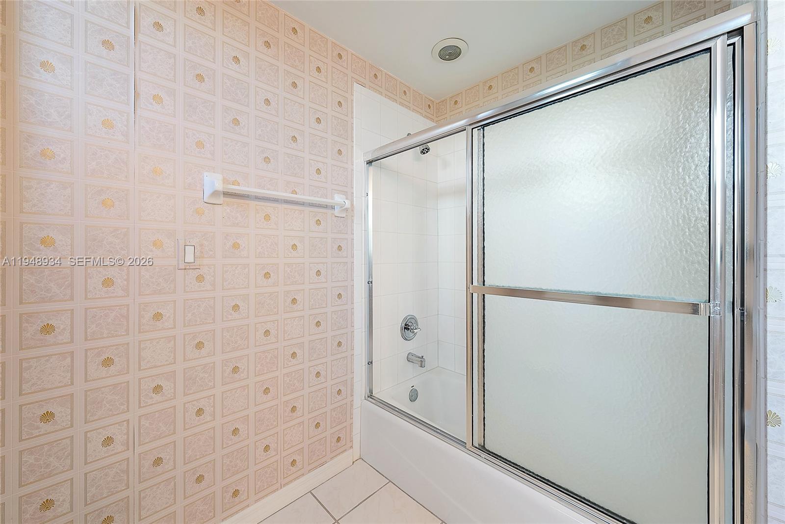 1660 Florida A1A, Unit 222 Jupiter, FL 33477 - Photo 18 of 34 a bathroom with a glass shower door
