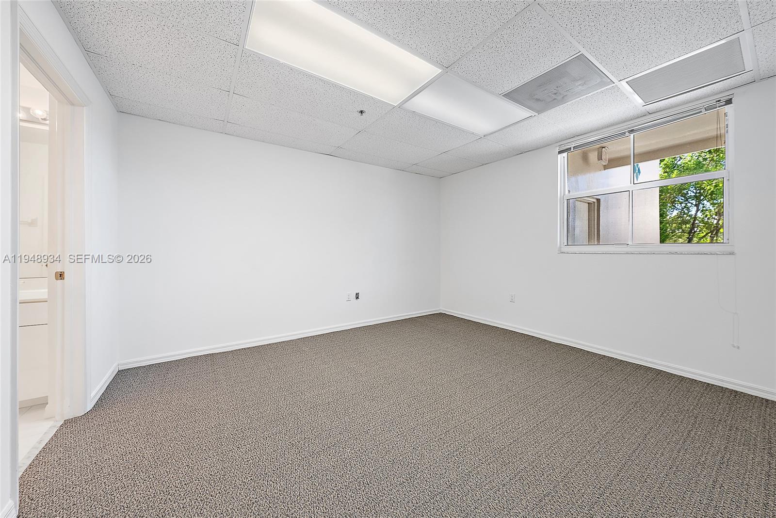 1660 Florida A1A, Unit 222 Jupiter, FL 33477 - Photo 22 of 34 an empty room with a window