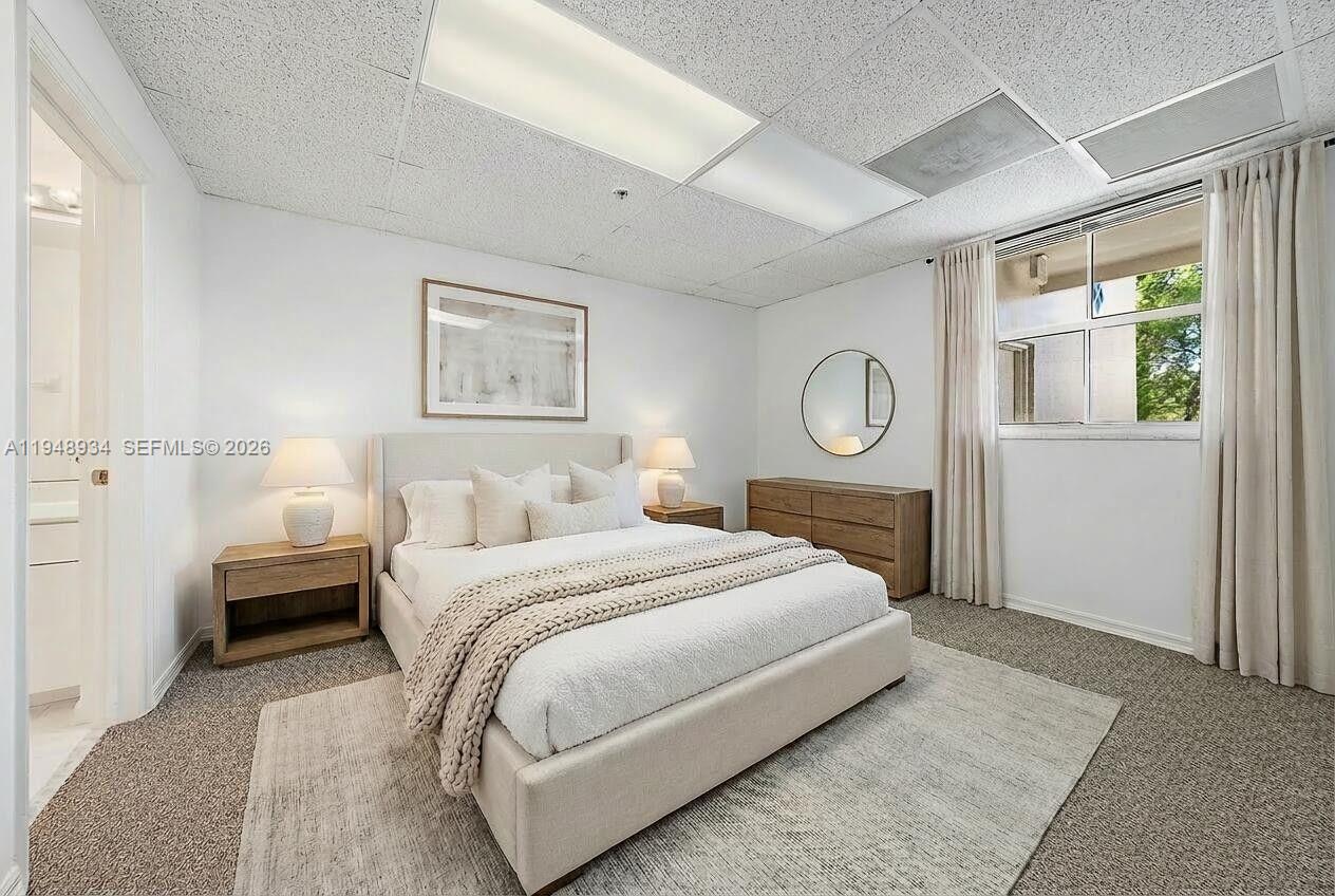 1660 Florida A1A, Unit 222 Jupiter, FL 33477 - Photo 23 of 34 a bed room with a bed and a window