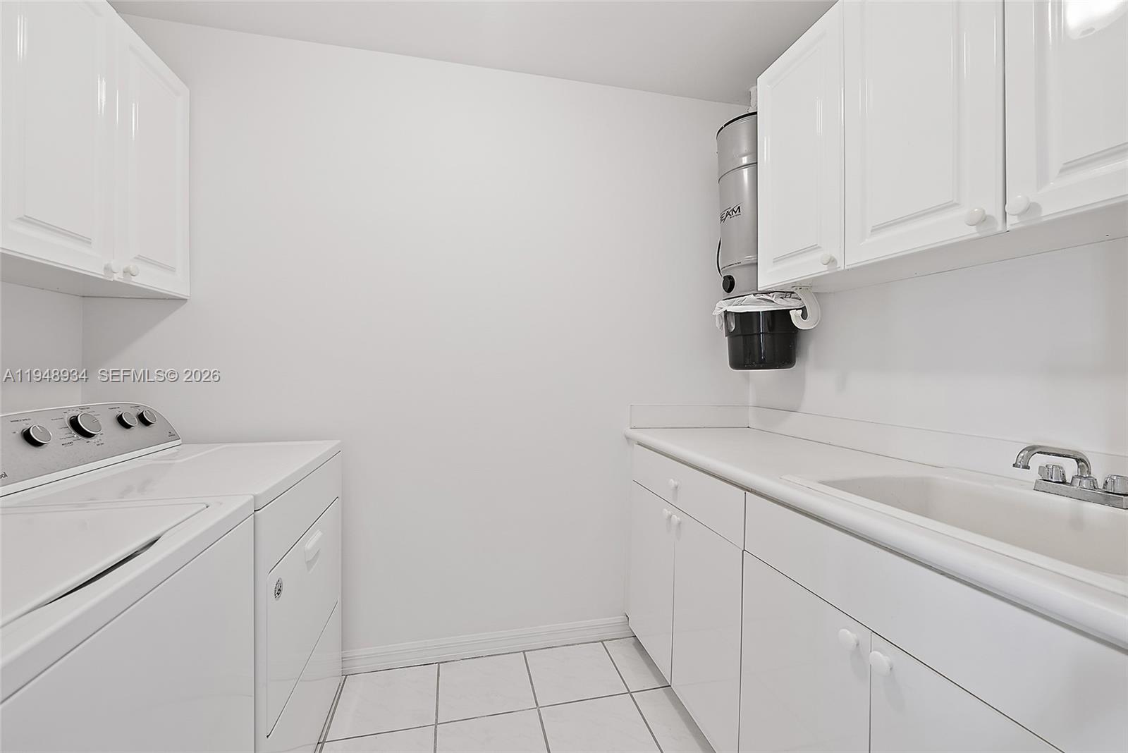 1660 Florida A1A, Unit 222 Jupiter, FL 33477 - Photo 25 of 34 a utility room with dryer and washer