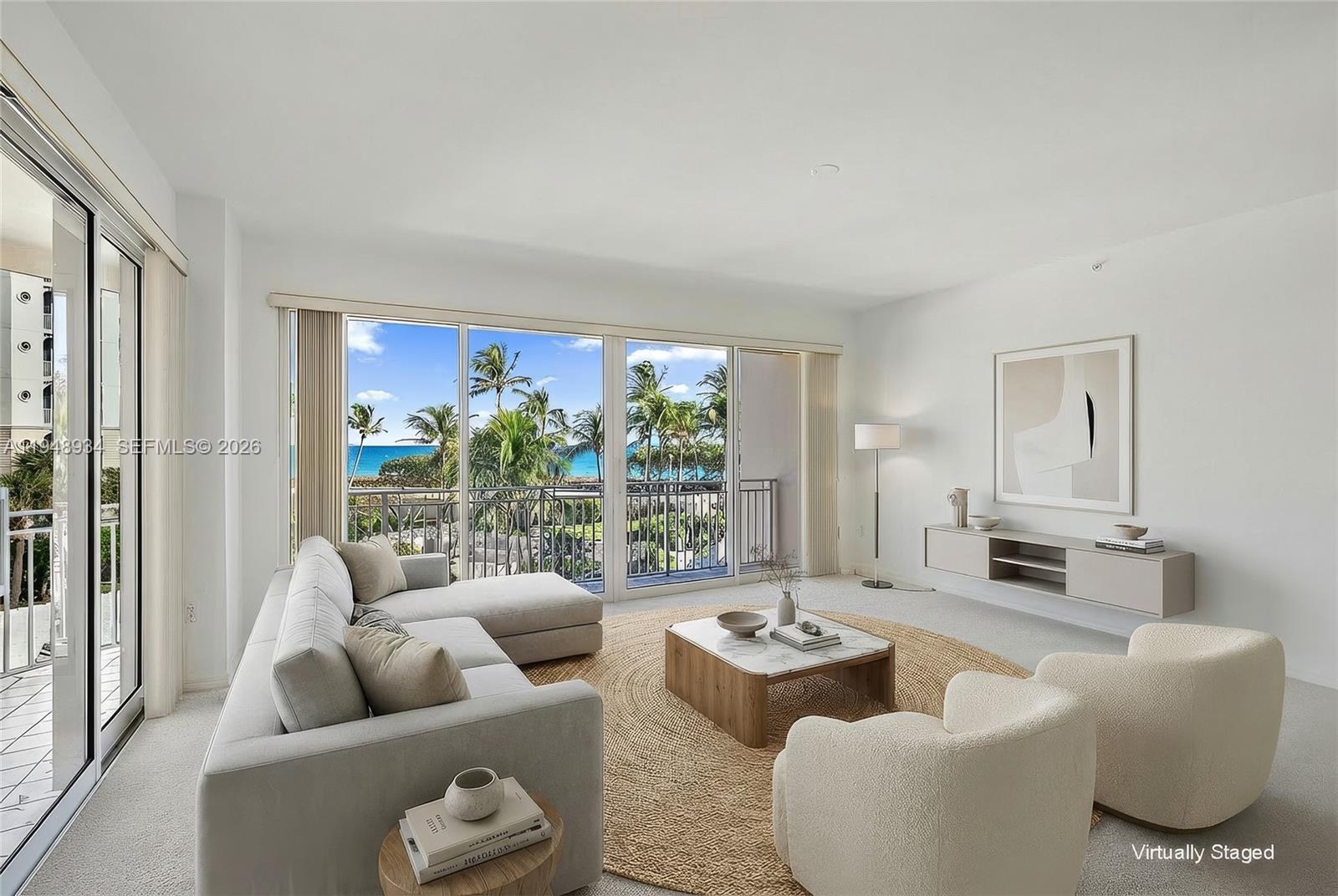 1660 Florida A1A, Unit 222 Jupiter, FL 33477 - Photo 4 of 34 a living room with furniture and a large window