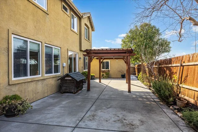 a kitchen with stainless steel appliances granite countertop a stove sink and cabinets