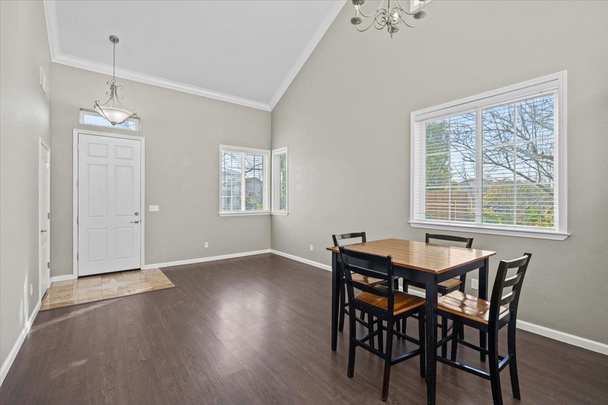 4056 Aitken Dairy Road Rocklin, CA 95677 - Photo 23 of 59 a view of a dining room with furniture and wooden floor