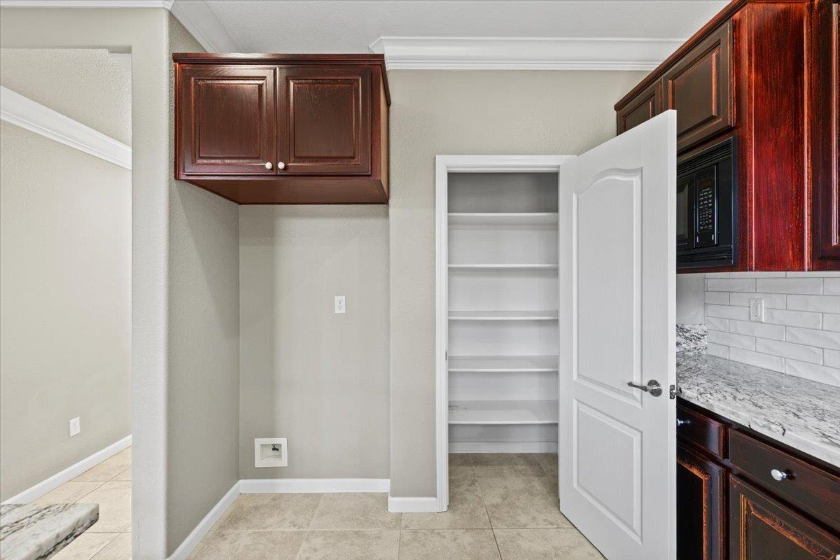 4056 Aitken Dairy Road Rocklin, CA 95677 - Photo 29 of 59 a view of walk in closet with empty racks