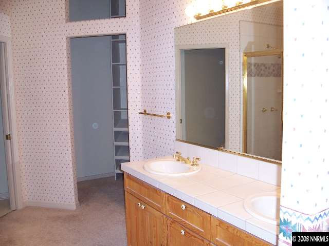 780 Putnam Drive Reno, NV 89503 - Photo 8 of 8 a bathroom with a sink and a mirror