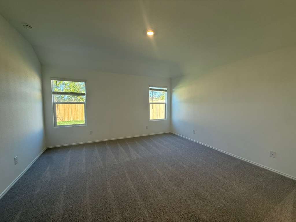 577 Sormonne Loop Kyle, TX 78640 - Photo 14 of 39 a view of an empty room with a window