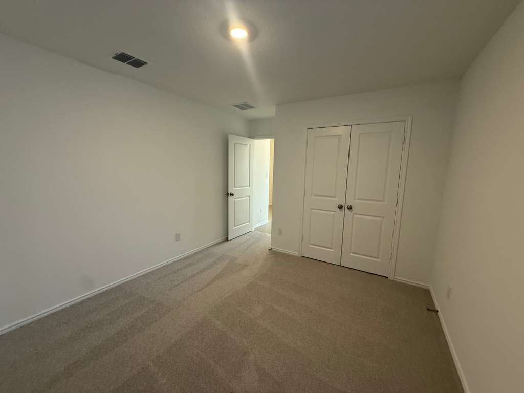 577 Sormonne Loop Kyle, TX 78640 - Photo 16 of 39 an empty room with an entryway
