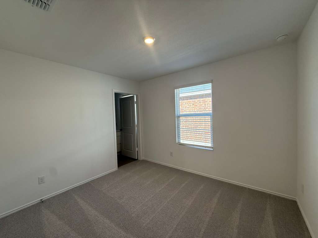 577 Sormonne Loop Kyle, TX 78640 - Photo 20 of 39 an empty room with a window