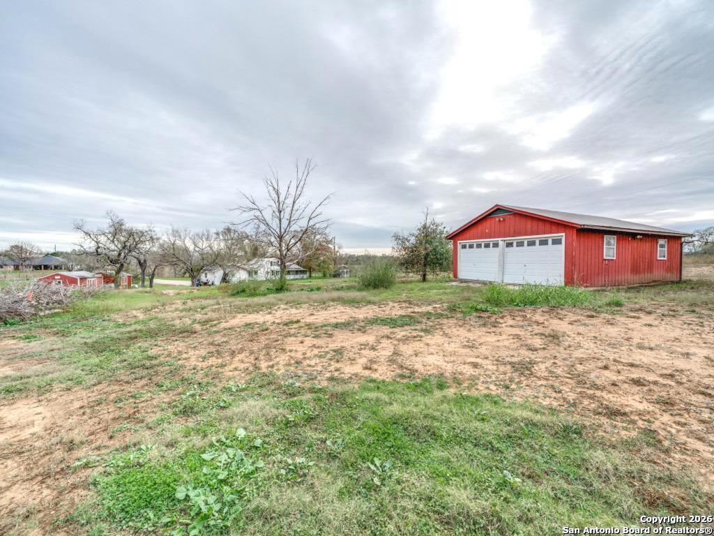 7431-7433 Real Road China Grove, TX 78263 - Photo 9 of 17 a view of an outdoor space and a yard