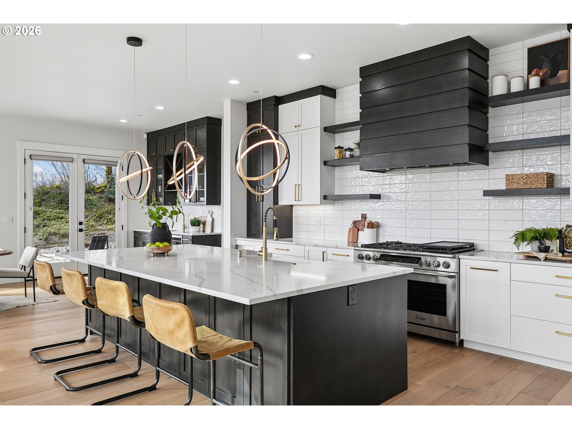 1757 North Columbia Ridge Way Washougal, WA 98671 - Photo 14 of 48 a kitchen with stainless steel appliances kitchen island granite countertop a sink cabinets and wooden floor
