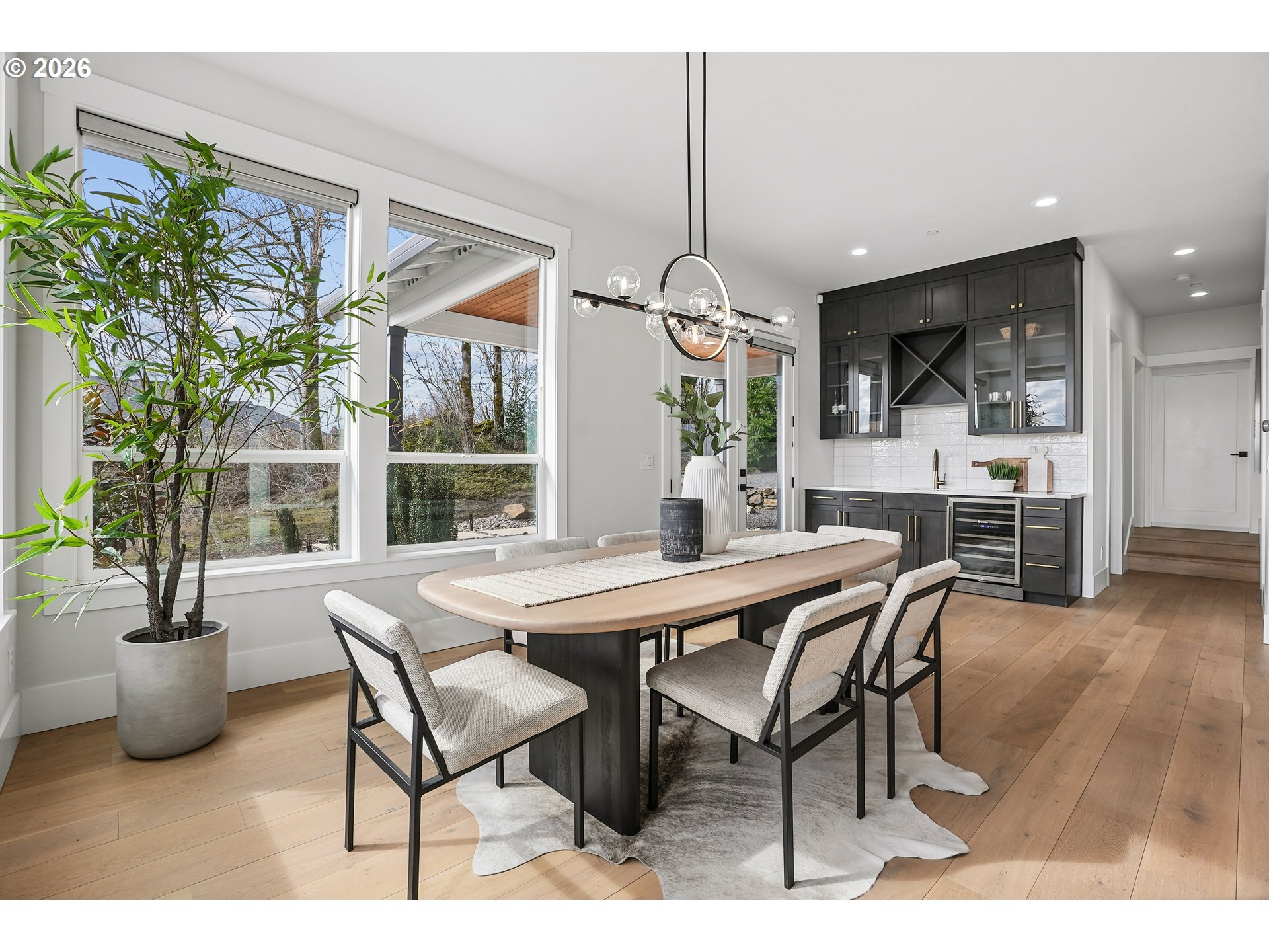 1757 North Columbia Ridge Way Washougal, WA 98671 - Photo 18 of 48 a dining room with furniture potted plants and wooden floor