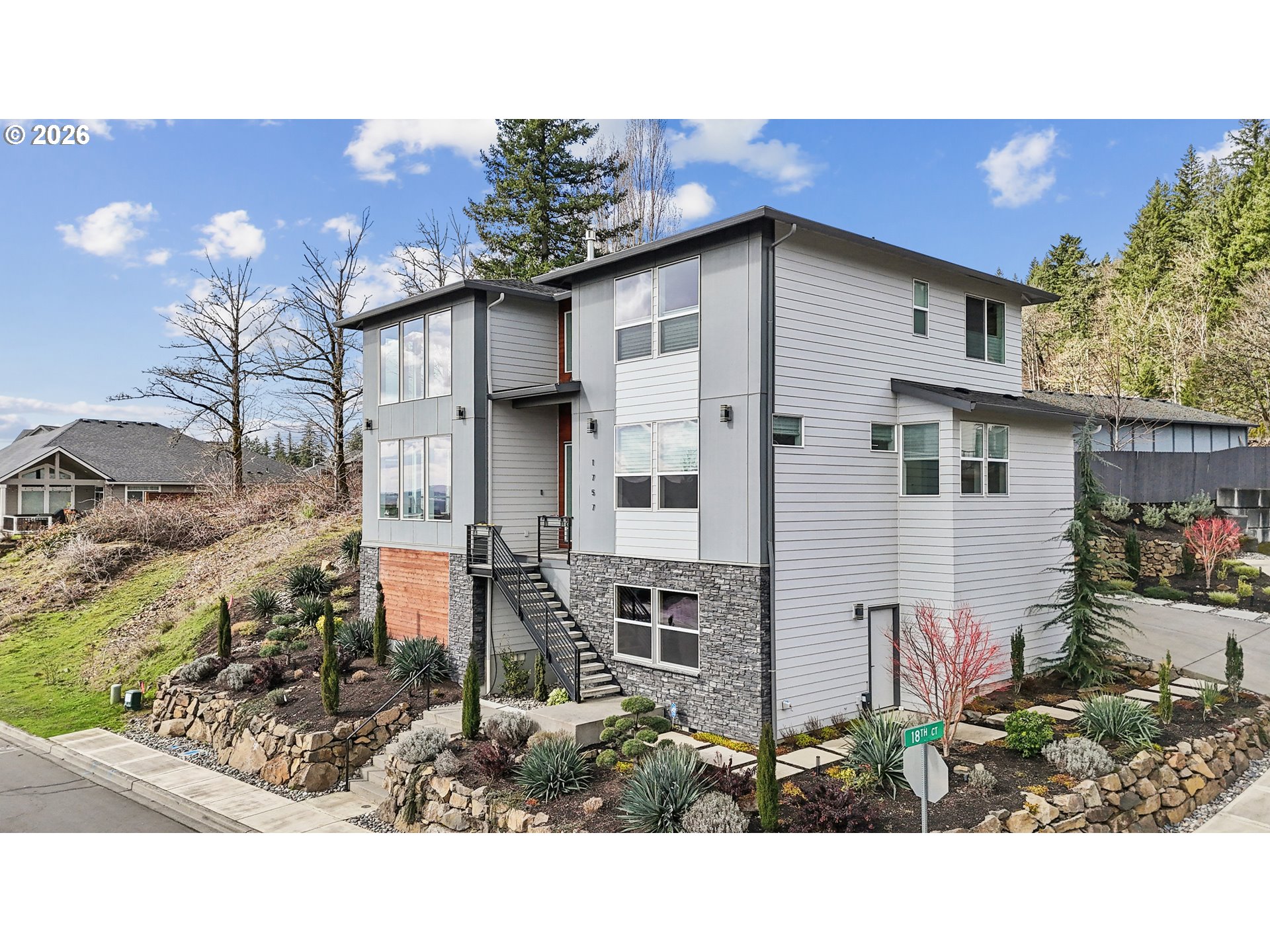 1757 North Columbia Ridge Way Washougal, WA 98671 - Photo 2 of 48 a backyard of a house with a yard and outdoor seating
