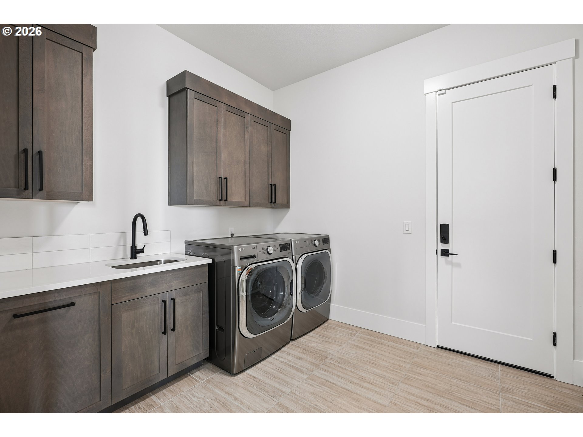 1757 North Columbia Ridge Way Washougal, WA 98671 - Photo 32 of 48 a utility room with sink dryer and washer