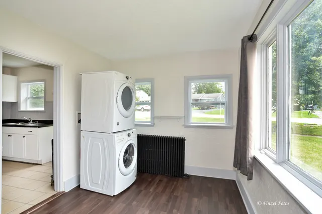 a view of a kitchen with dishwasher and wooden floor