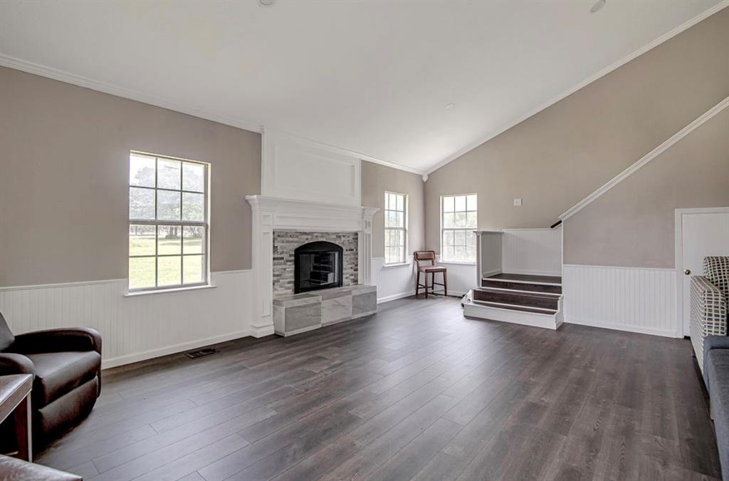 3952 J J Rendon Road Burleson, TX 76028 - Photo 6 of 25 Vaulted ceilings make this large living room feel even more spacious. Lots of natural light makes this space so cozy.