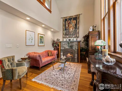 a living room with furniture and a rug