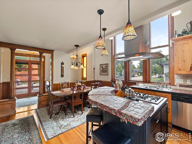 a living room with furniture a window and a table