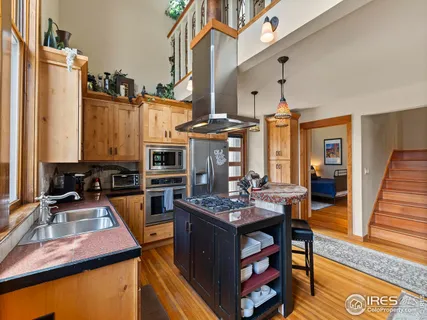 a room with furniture a flat screen tv and a table