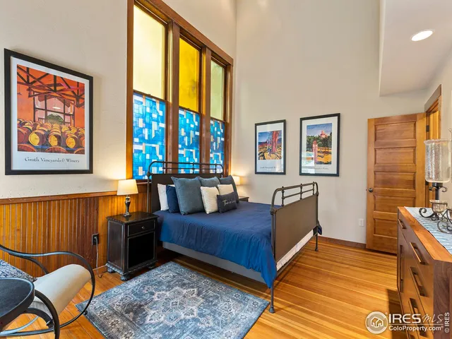 a bedroom with furniture and a window