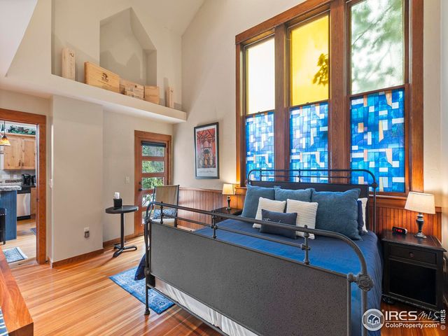 a living room with furniture and large windows