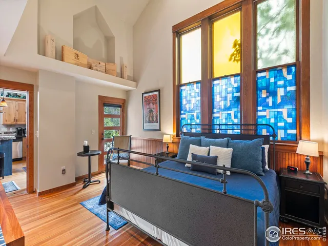 a living room with furniture and large windows