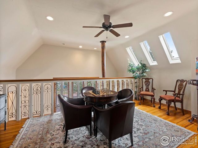 a living room with furniture a window and a sink