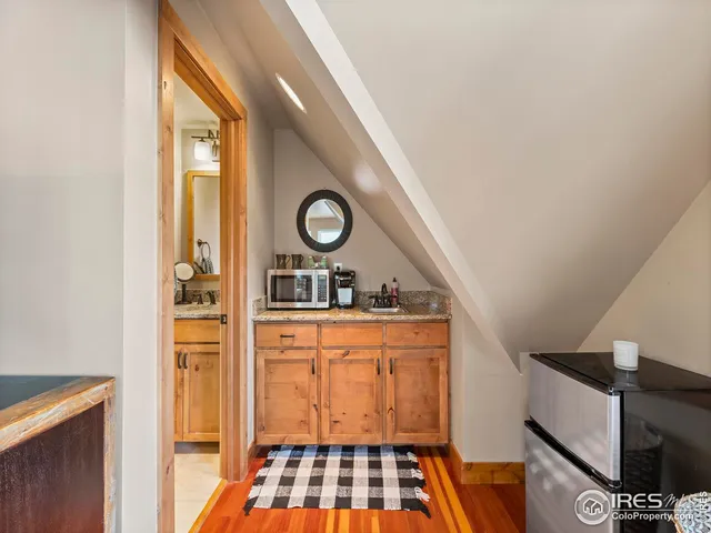a bathroom with a granite countertop sink mirror and double