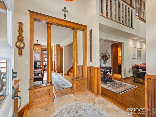 a living room with furniture a flat screen tv and a table