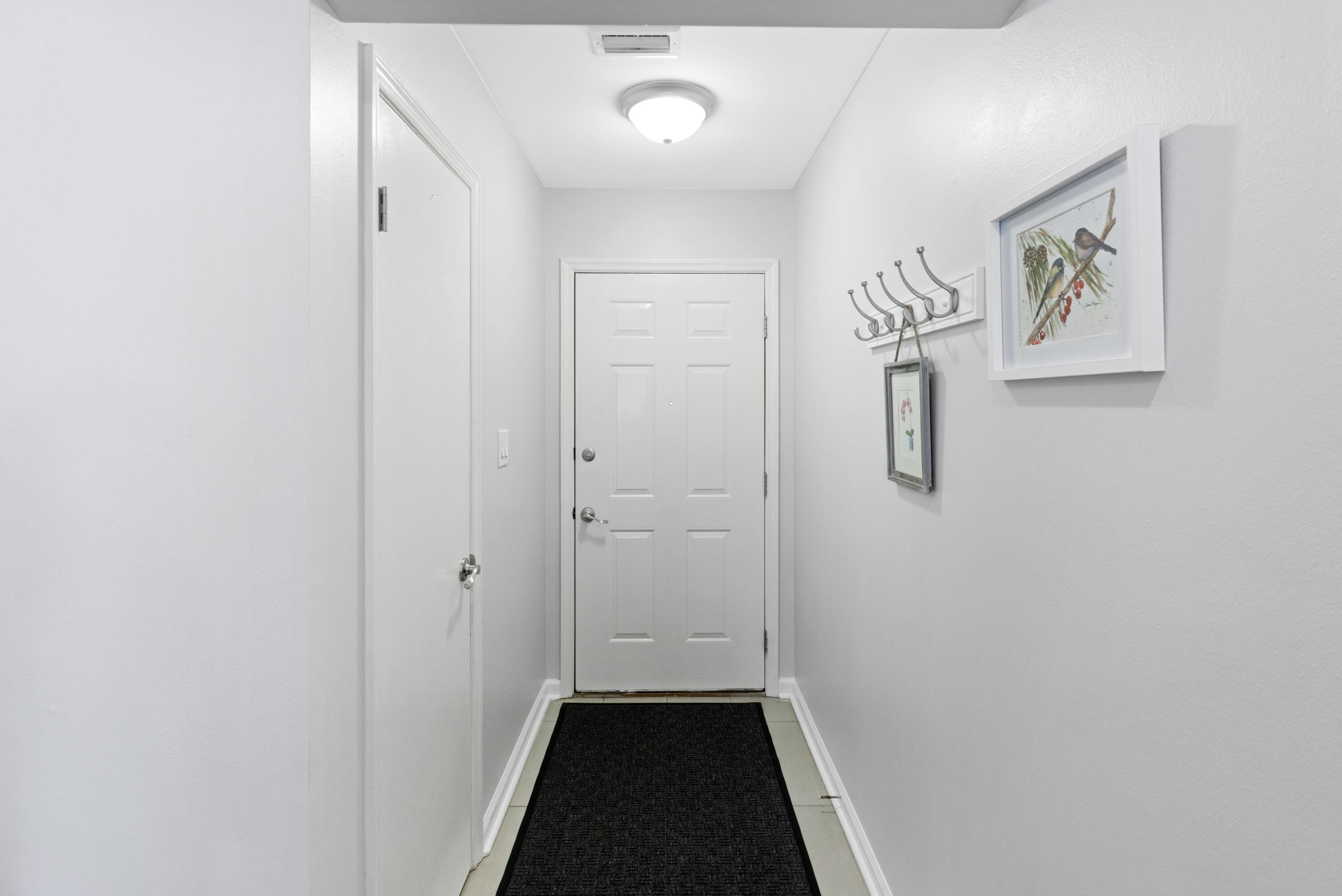 861 Mack Bayou Road Miramar Beach, FL 32550 - Photo 3 of 47 a view of a hallway with closet