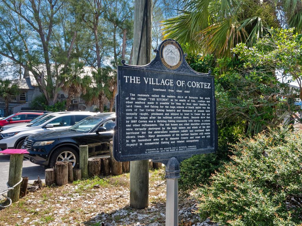 4210 128th Street West Cortez, FL 34215 - Photo 13 of 15 a front view of a house with sign board