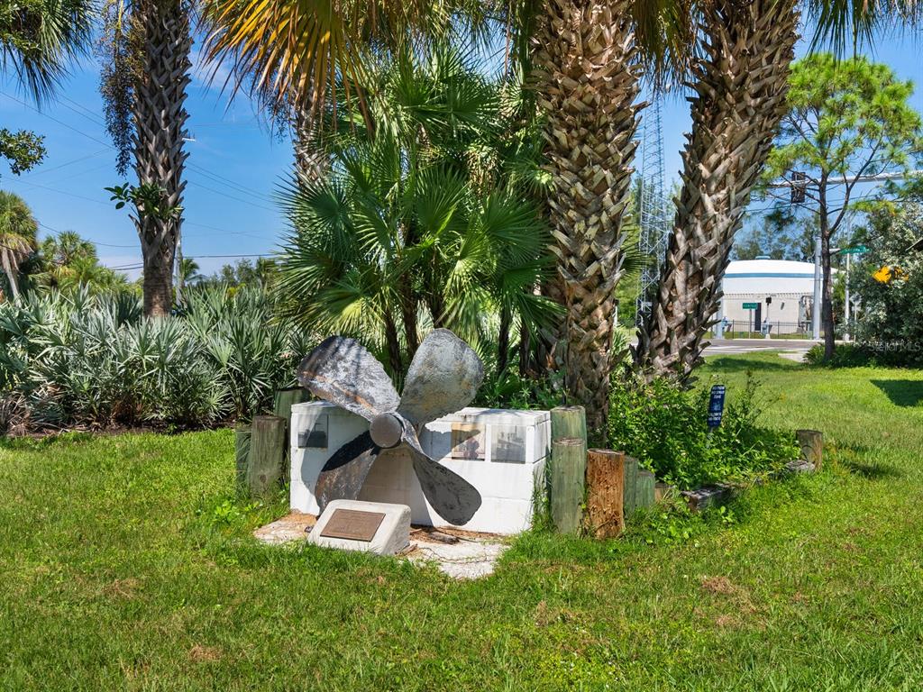 4210 128th Street West Cortez, FL 34215 - Photo 15 of 15 a garden with trees in front of it